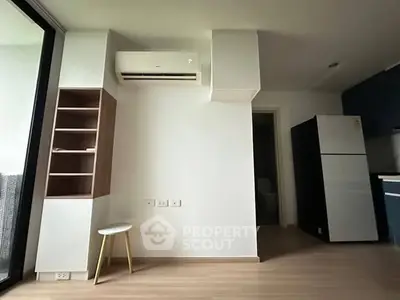 Modern apartment interior with air conditioning and sleek kitchen design