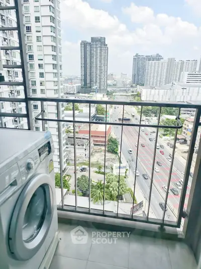 High-rise balcony with washing machine and stunning city view