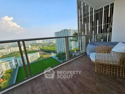 Spacious balcony with stunning city view in modern high-rise apartment