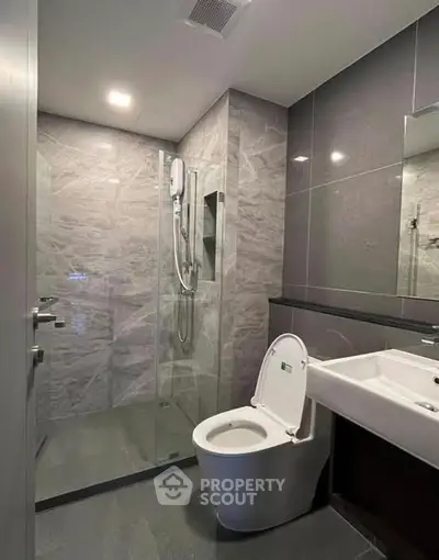 Modern bathroom with sleek design and glass shower enclosure