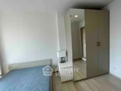 Modern bedroom with sleek wardrobe and minimalist design