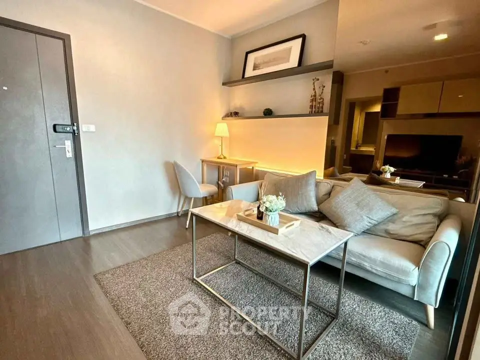 Modern living room with stylish decor and cozy seating area in a contemporary apartment.