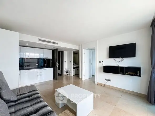 Modern living room with sleek design and open kitchen layout