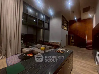 Luxurious modern living room with high ceilings and elegant decor