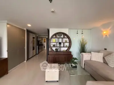Spacious modern living room with elegant decor and open kitchen layout
