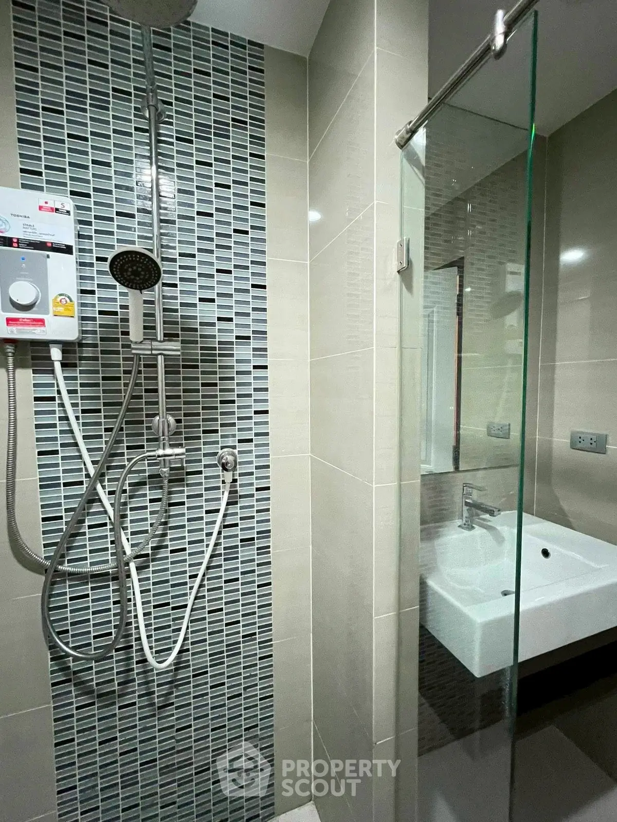 Modern bathroom with sleek shower and glass partition