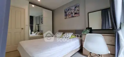 Modern bedroom with stylish decor and large mirror wardrobe