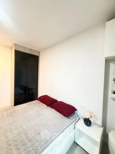 Cozy bedroom with modern decor and stylish wardrobe, perfect for relaxation and comfort.