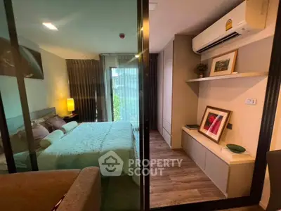 Modern bedroom with glass partition, cozy decor, and air conditioning in a stylish apartment.