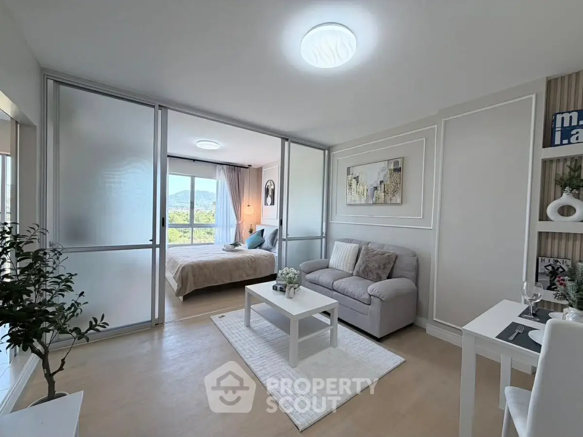 Modern open-plan living room with cozy sofa and elegant decor