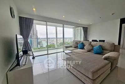Spacious living room with stunning city view and modern furnishings