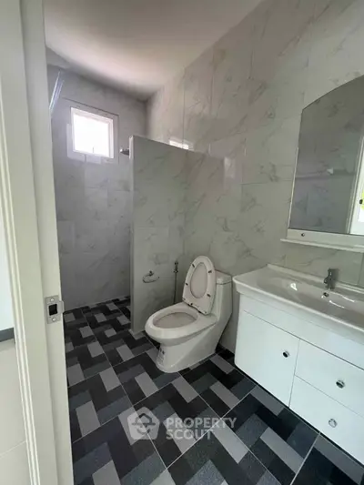 Modern bathroom with sleek tiles and contemporary fixtures
