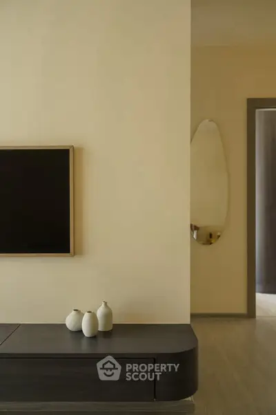 Modern living room with minimalist decor and sleek furniture design.