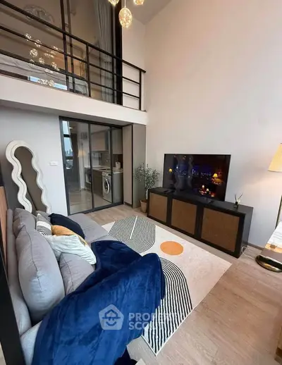 Modern duplex living room with stylish decor and mezzanine view