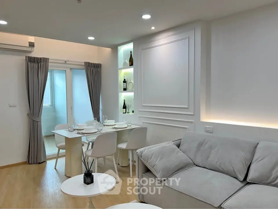 Modern living room with elegant dining area and stylish decor