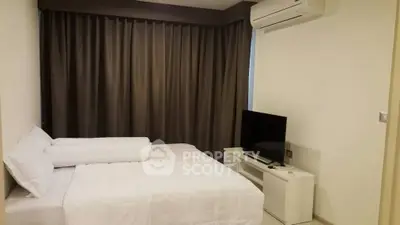 Cozy bedroom with air conditioning and modern TV setup, perfect for relaxation.