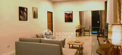 Spacious living room with modern decor and cozy seating area