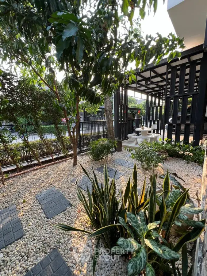 Tranquil garden oasis with modern pergola, lush greenery, and elegant stone pathways, perfect for serene outdoor living and relaxation.
