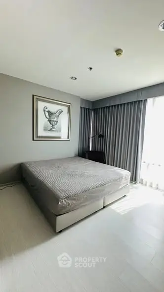 Modern minimalist bedroom with large window and stylish decor