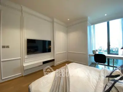 Luxurious bedroom with modern decor and large window offering city view