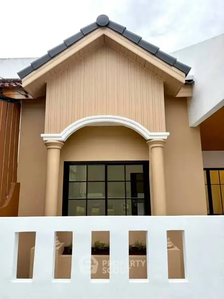 Charming exterior facade with classic architectural details and elegant columns.