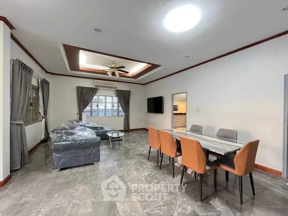 Spacious modern living room with elegant dining area and stylish furniture
