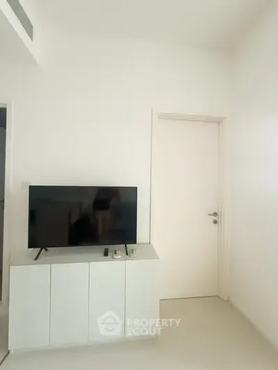 Modern living room with sleek TV stand and minimalist decor