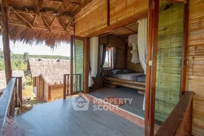 Charming bamboo cabin with open balcony and scenic view