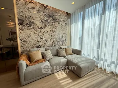 Stylish living room with modern sofa and large window for natural light