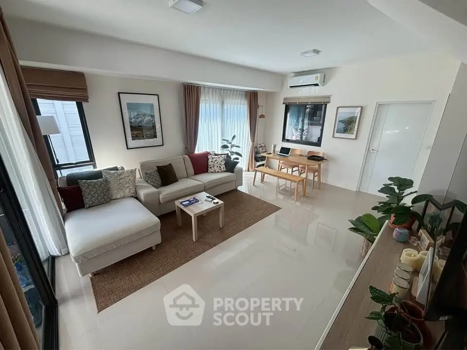 Spacious modern living room with stylish decor and natural light