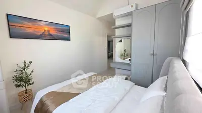 Modern bedroom with stylish decor and natural light