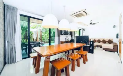 Spacious modern living room with dining area and garden view