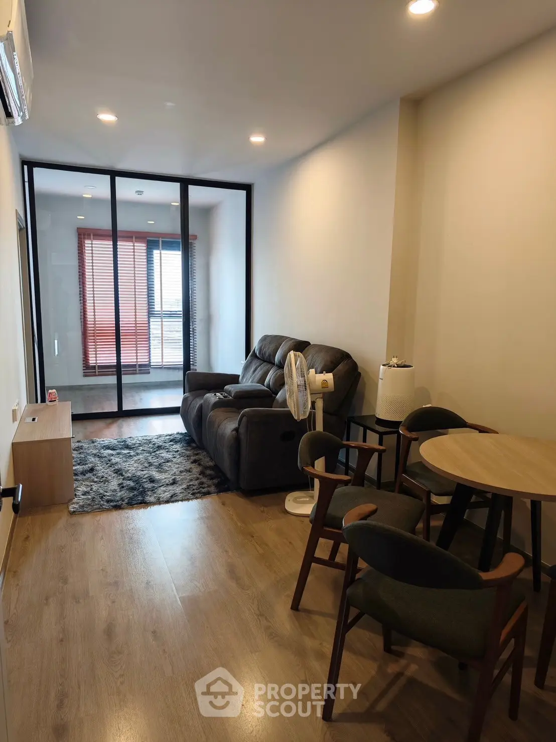 Modern living room with cozy seating and stylish decor in a contemporary apartment.