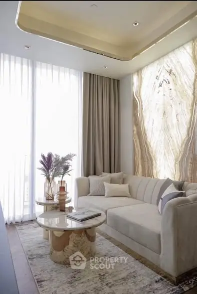 Luxurious living room with elegant marble wall and modern decor