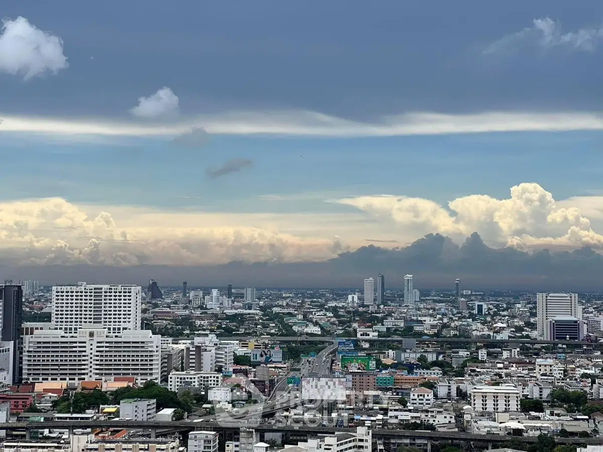 Stunning cityscape view with expansive skyline and dramatic clouds, perfect for urban living enthusiasts.
