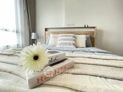 Elegant bedroom with cozy bedding and stylish decor, perfect for relaxation and comfort.