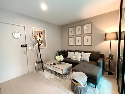 Modern living room with stylish decor and cozy seating area.