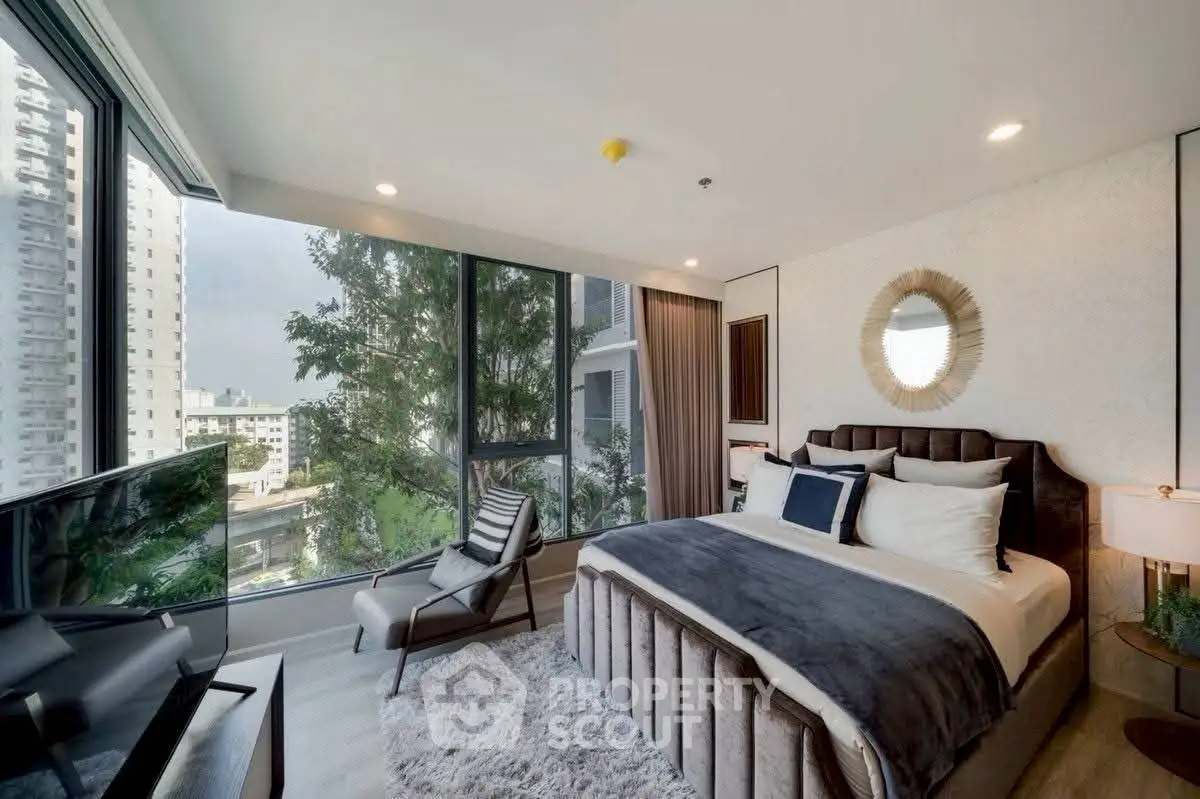 Luxurious modern bedroom with large windows and city view