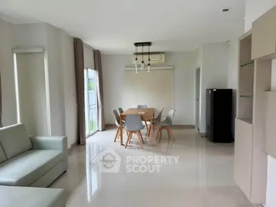 Spacious modern living room with dining area and sleek furniture