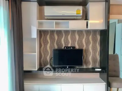 Modern living room with stylish TV unit and air conditioning