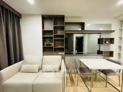 Modern living room with sleek furniture and built-in shelving