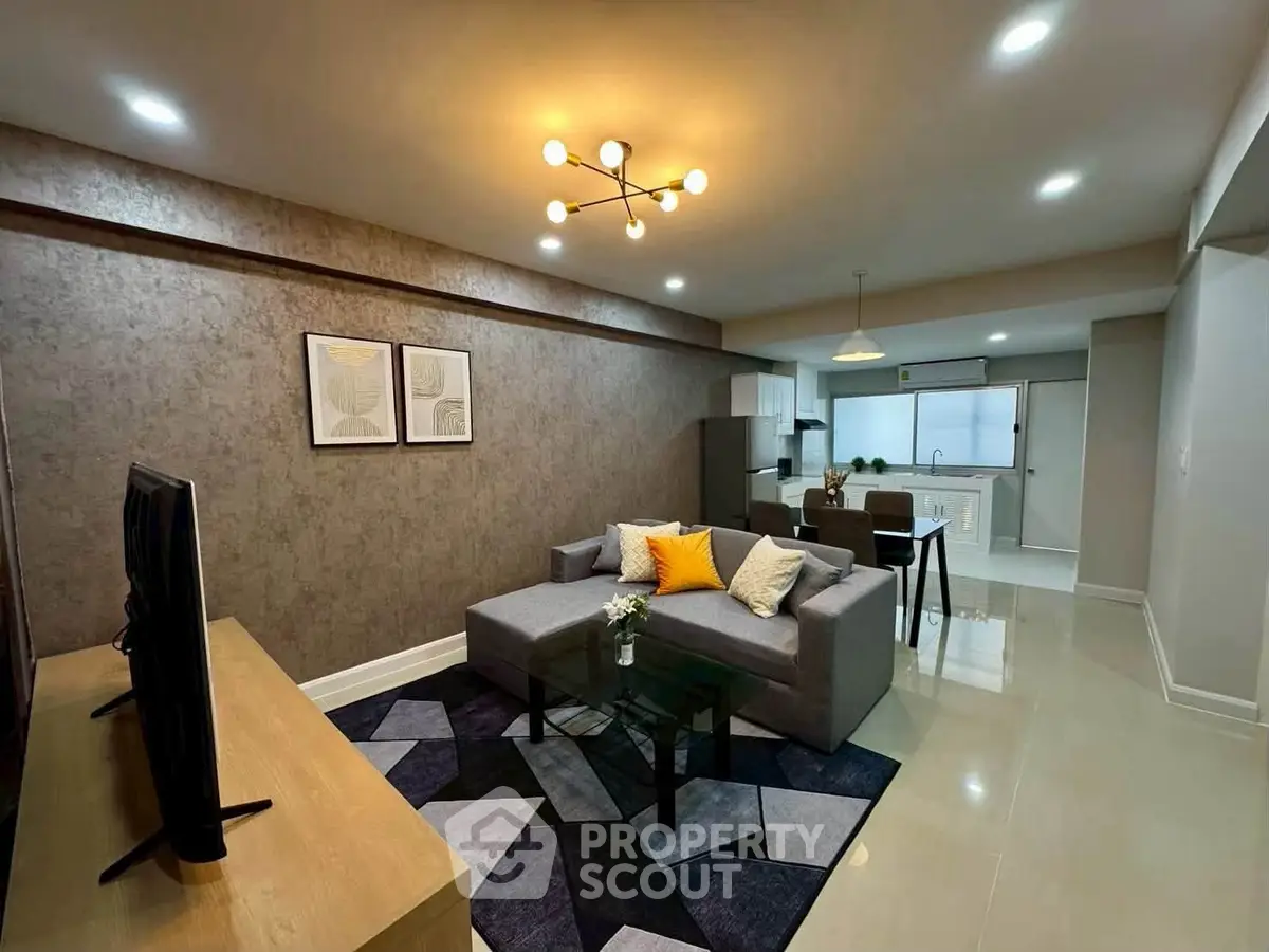 Spacious modern living room with stylish decor and open kitchen layout