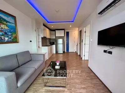 Modern living room with sleek design, featuring a cozy sofa, stylish coffee table, and contemporary kitchen area.