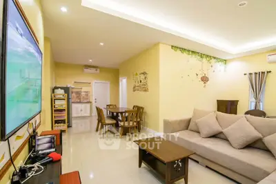 Spacious living room with modern decor and cozy seating area