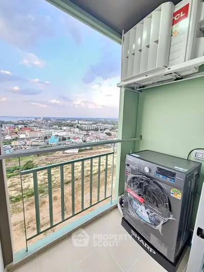 High-rise balcony with washing machine and stunning city view