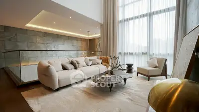 Luxurious modern living room with high ceilings and elegant furnishings.