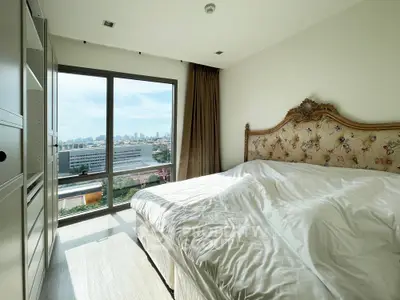 Luxurious bedroom with stunning city view and elegant decor