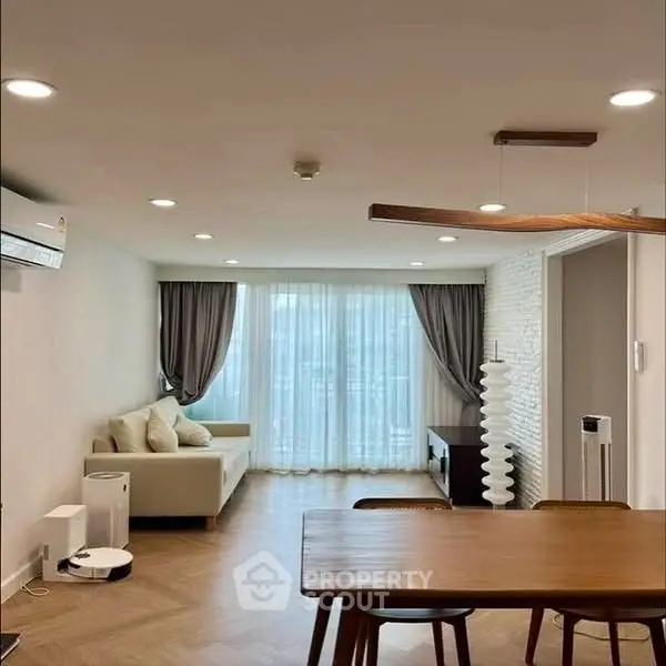 Spacious modern living room with elegant decor and natural light
