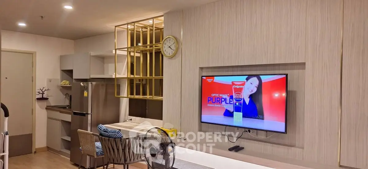 Modern living room with wall-mounted TV and stylish decor