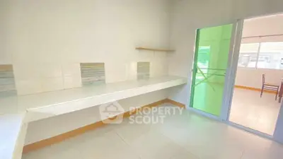 Spacious kitchen with modern open layout and sliding glass doors